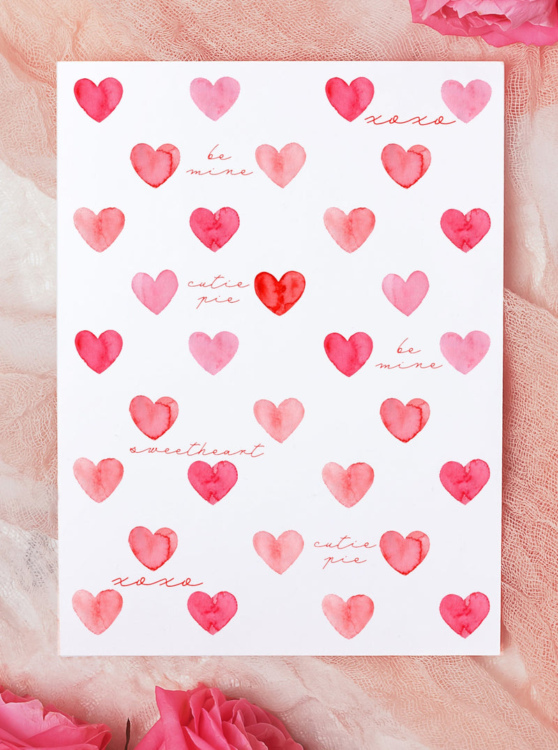 red pink hearts with valentine's day sayings on valentine's day greeting card