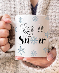 let it snow coffee mug,  snowflake coffee mug, winter mug.  Blue snowflakes with Let It Snow BLACK lettering.  11 OZ. C-Handle