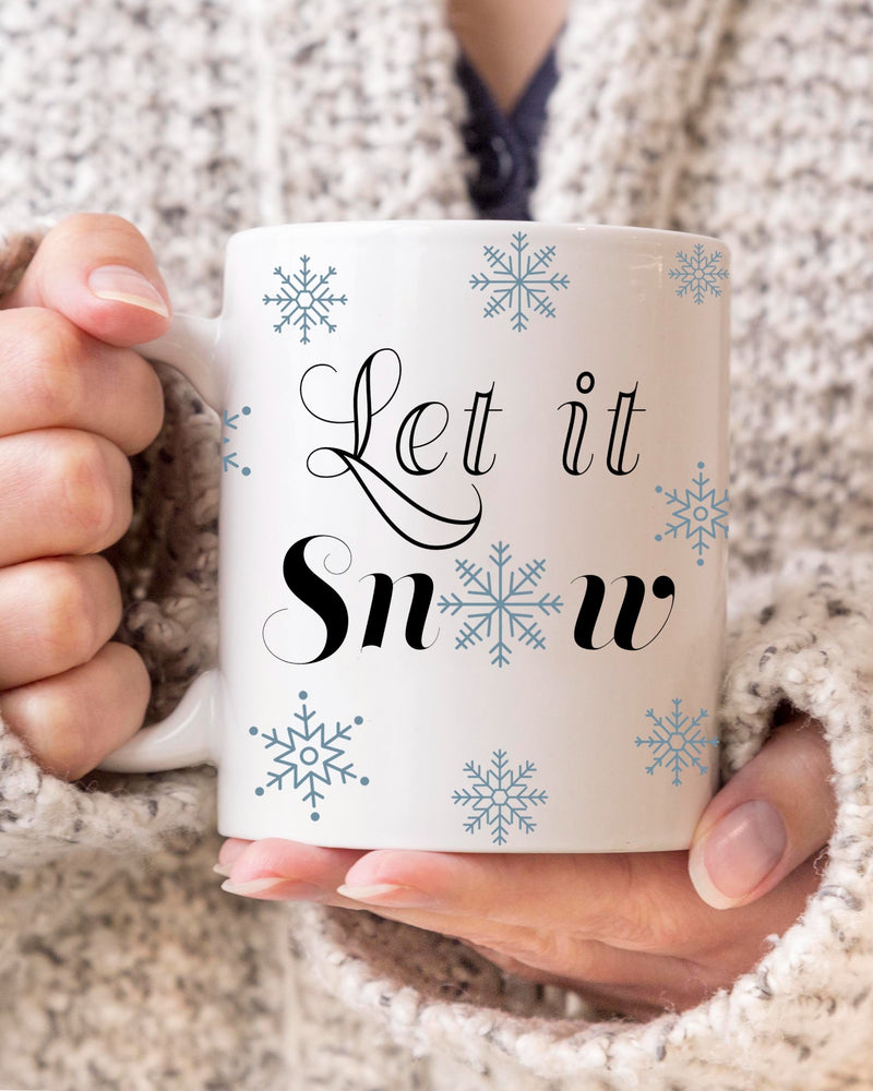 let it snow coffee mug,  snowflake coffee mug, winter mug.  Blue snowflakes with Let It Snow BLACK lettering.  11 OZ. C-Handle