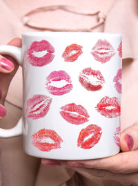 lipstick kisses holding coffee mug