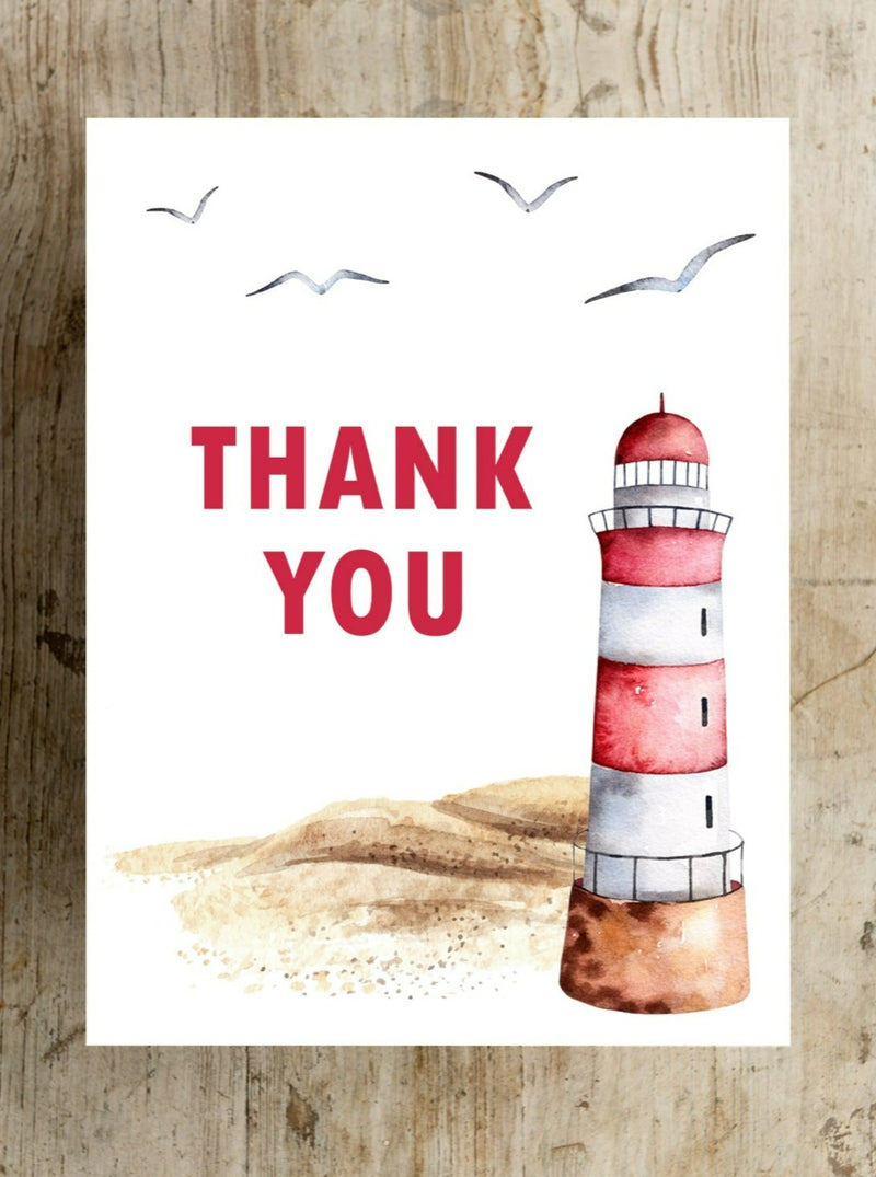 "A picturesque sandy beach with a red and white lighthouse set against a serene coastal backdrop, complemented by a heartfelt thank you in Red Lettering card design, evoking gratitude and a sense of calm seaside appreciation."