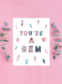 the card has a colorful display of quartz and crystals with the words you're a gem in the middle
