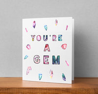 the card has a colorful display of quartz and crystals with the words you're a gem in the middle