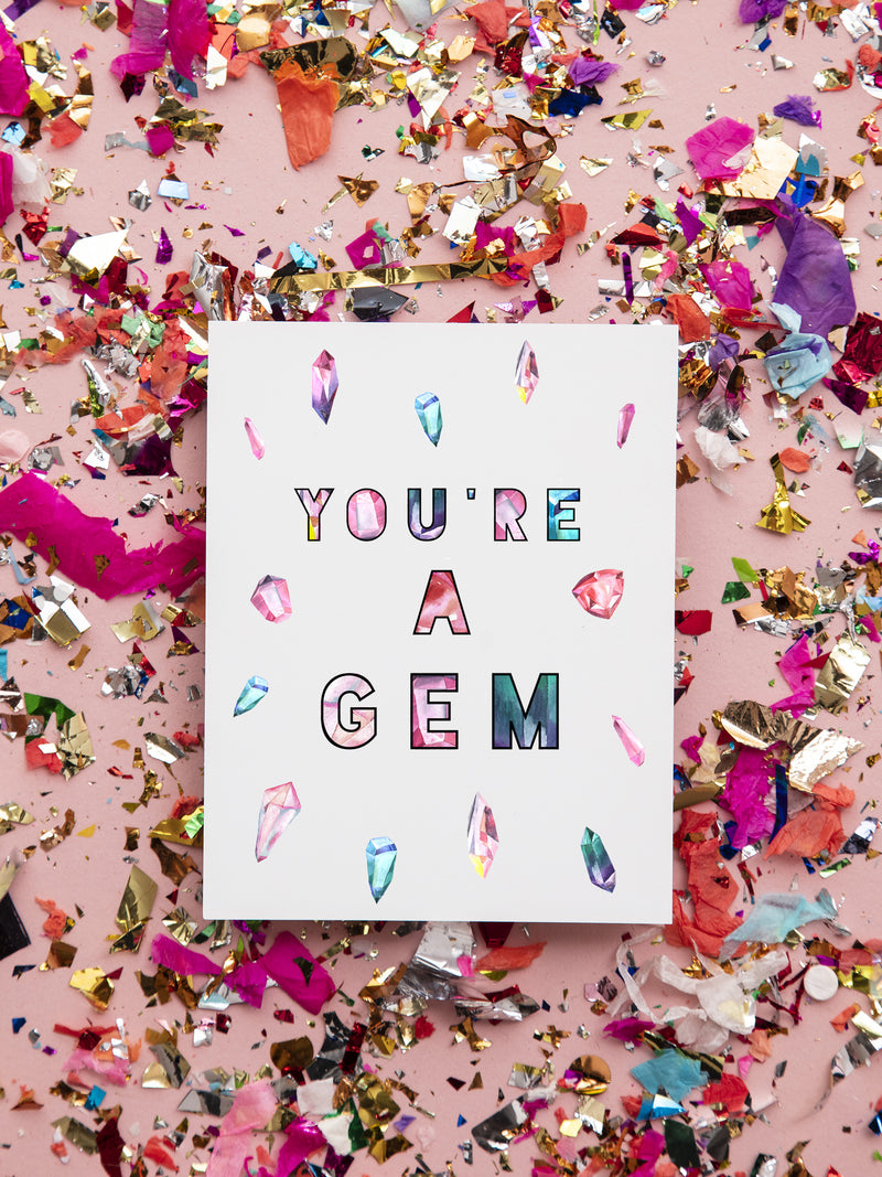 the card has a colorful display of quartz and crystals with the words you're a gem in the middle